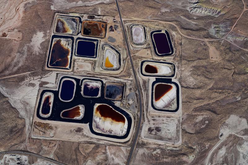 Overhead view of an oil and gas field with pockets of minerals and materials that resemble lakes