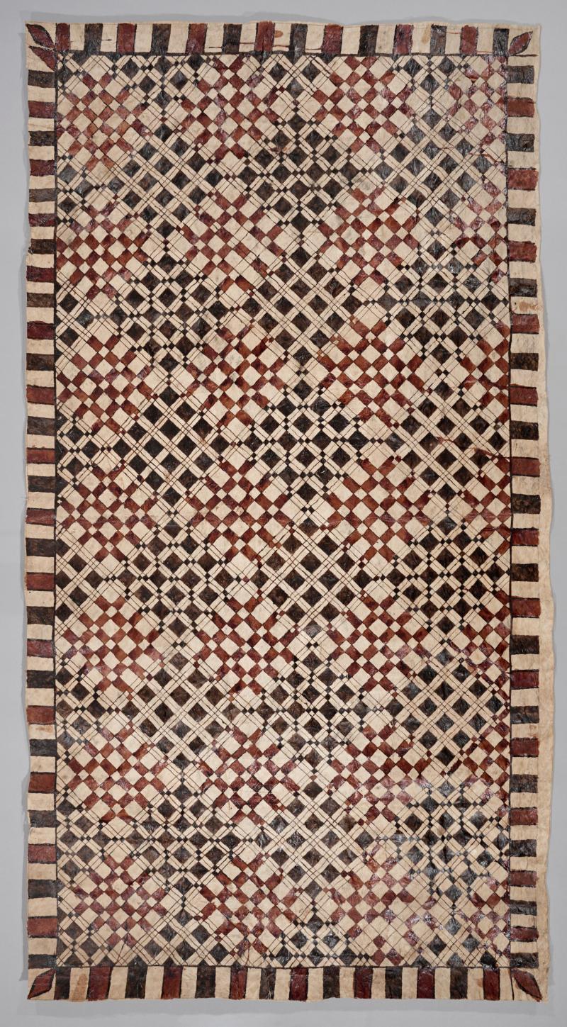 Large textile with repeating square patterns of black and dark red