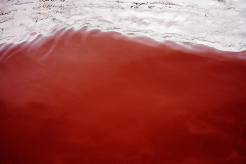 Photograph of the great salt lake with a large swath of red sand