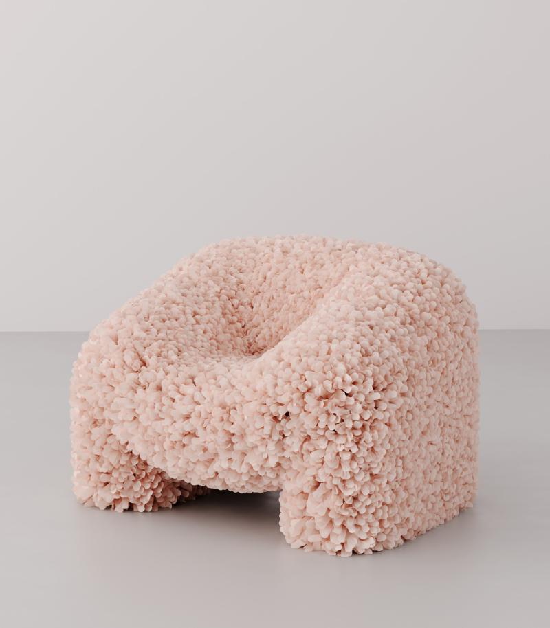 Pink chair made out of molded foam