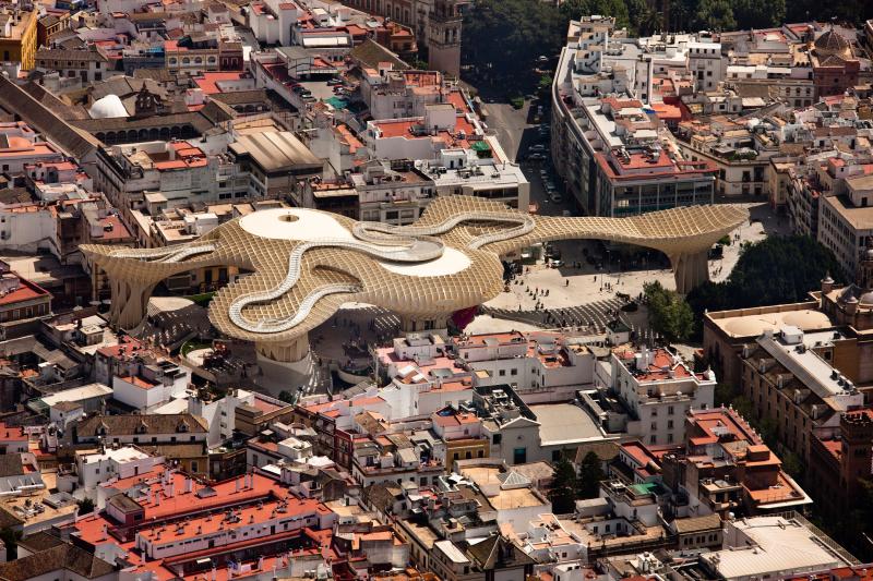 Aerial view of a snake-like structure in a bustling Spain city