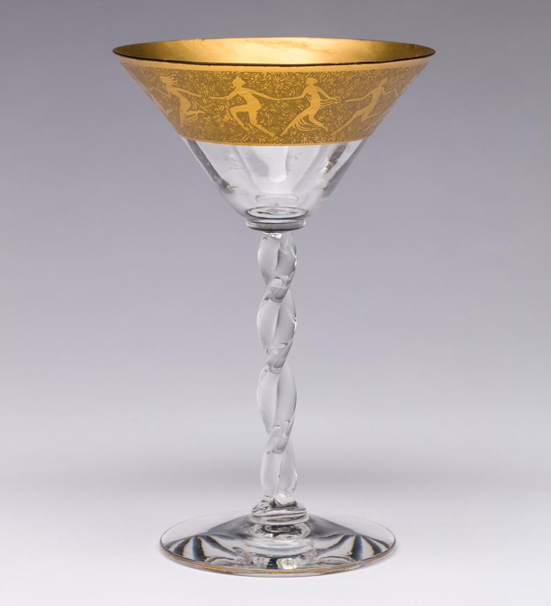 Cocktail glass with twisted stem and gold encrusted etch.