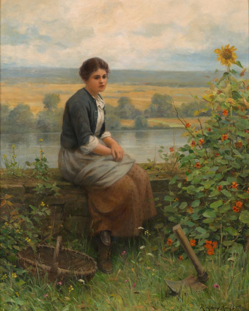 A woman sitting on a log by the lake, contemplating