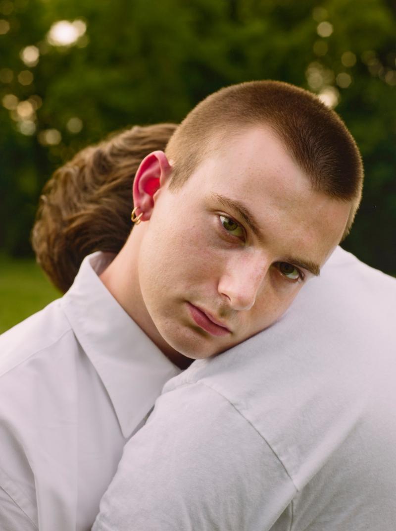 Two young men embracing
