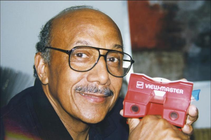Charles Harrison holding a red View-Master