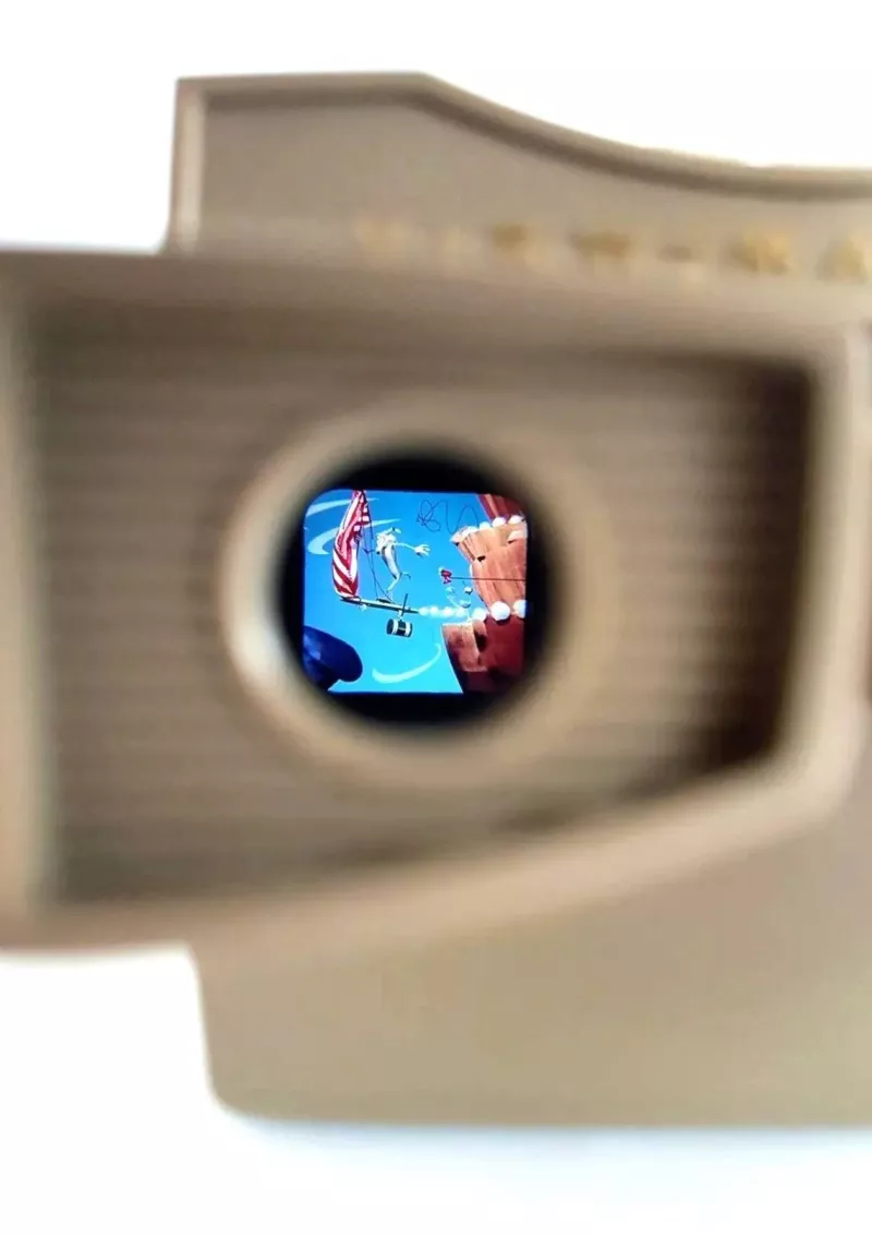 a look through a view master at a color cartoon of Wile E. Coyote falling from cliff
