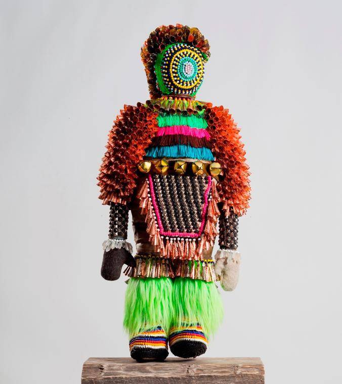 Jeffrey Gibson (Mississippi Band Choctaw/Cherokee), Like A Hammer, 2014. Elk hide, glass beads, artificial sinew, wool blanket, metal studs, steel, found pinewood block, and fur; 56 x 24 x 11 in.