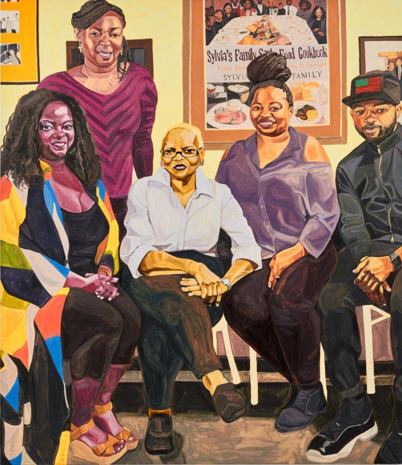 portrait of a woman with four other family members at Sylvia's restaurant in Harlem
