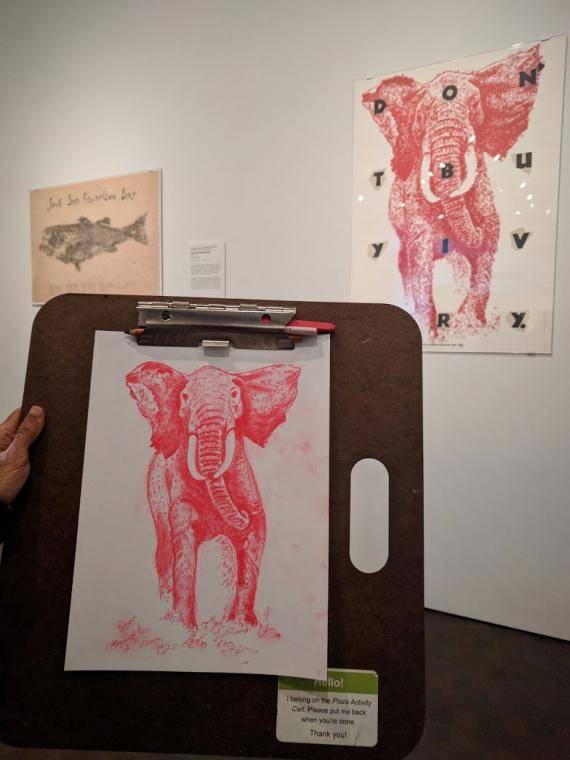 drawing of a poster with a red elephant on it in the Stampede exhibition